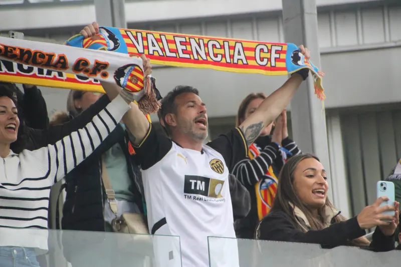 Valencia CF supporters cheering in the stand